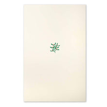 A cream-colored Christmas card with a small mistletoe sprig of green leaves and red berries in the center.