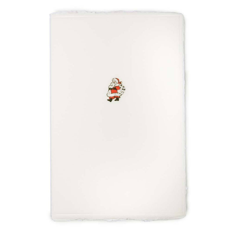 A cream-colored Christmas card with deckled edges, featuring a small illustration of Santa Claus in a red suit holding a sack of gifts.