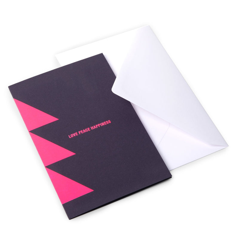 A sleek dark card with neon pink triangle accents and the words LOVE PEACE HAPPINESS in the center, paired with a white envelope.