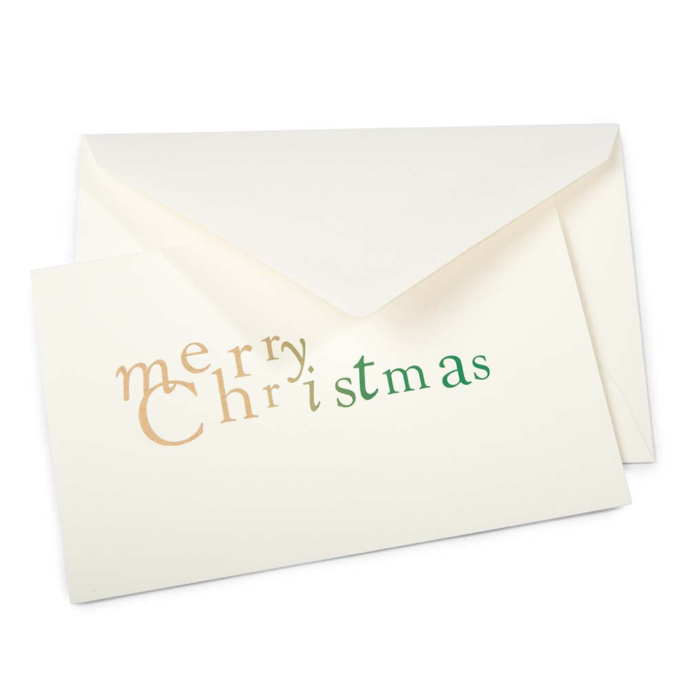 Elegant cream Christmas card featuring the phrase 'merry Christmas' in playful gold and green lettering, accompanied by a matching envelope.
