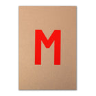 Christmas card with a metallic gold background and a large red letter “M” in the center.