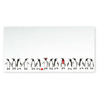 White Christmas card decorated with a row of hand-drawn black and white penguins, some wearing red accessories like a scarf, hat, or holding a ball.