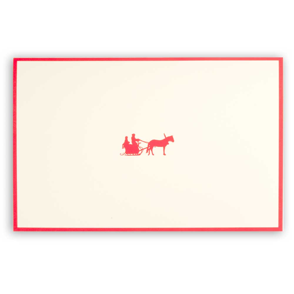 Cream-colored Christmas card with red border, showing a red silhouette of Santa in a sleigh pulled by one reindeer.