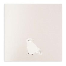 Minimalist Christmas card in pearly white with a simple illustration of a snowy owl.