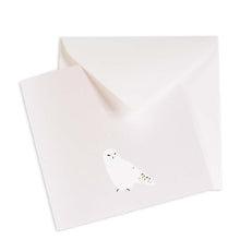 Minimalist Christmas card in pearly white with a simple illustration of a snowy owl, matched with a white envelope.