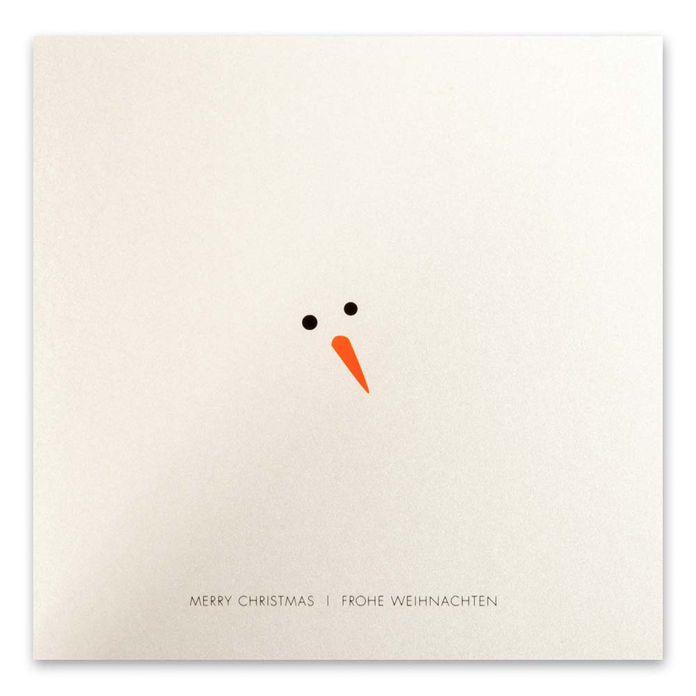 Minimalist Christmas card showing only a snowman's black eyes and orange carrot nose on a shimmering white background, with 'Merry Christmas' and 'Frohe Weihnachten' printed below.