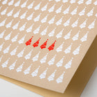 A close-up of a minimalist Christmas card featuring rows of white Christmas tree icons with a few red trees highlighted in the center.