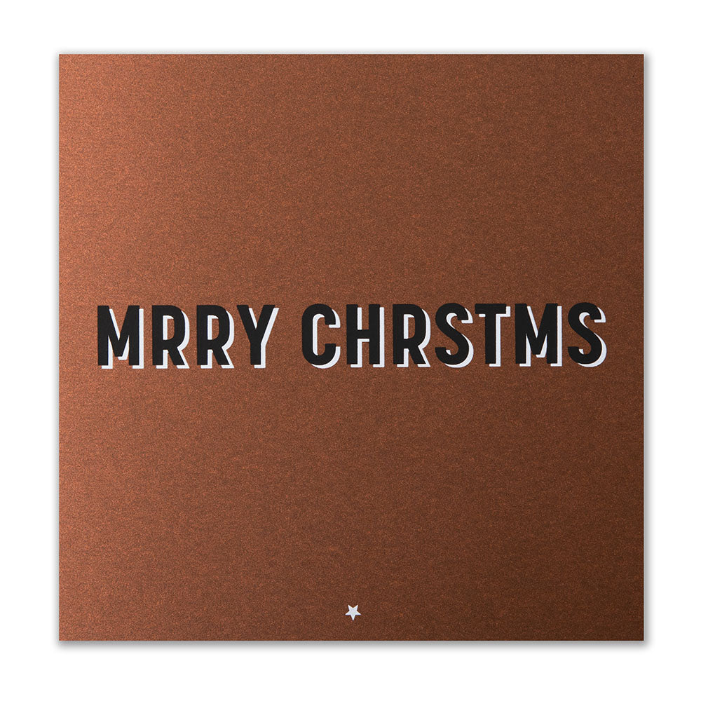 Brown Christmas card with bold black and white shadow text spelling “MRRY CHRSTMS” in a playful, minimalist font.