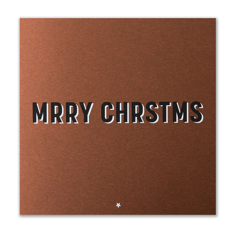 Brown Christmas card with bold black and white shadow text spelling “MRRY CHRSTMS” in a playful, minimalist font.