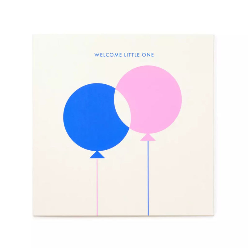 A minimalist greeting card with a soft cream background, featuring two overlapping balloons in blue and pink with fine strings, and the subtle text “WELCOME LITTLE ONE” centered above.